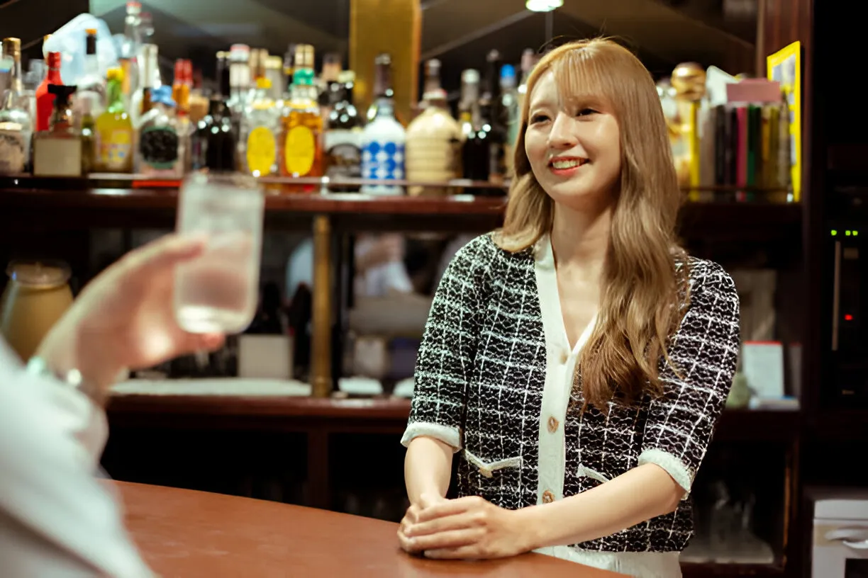 Young woman providing alcohol at the bar